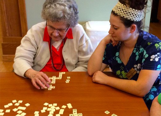 Resident and Nurse Playing Games at The Neighbors