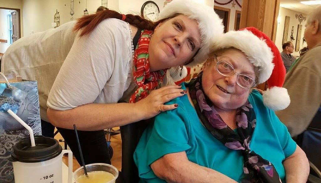 A family member visiting a resident during the Christmas Party at The Neighbors of Dunn County.