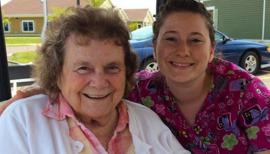 A nurse with a resident outside at The Neighbors of Dunn County. A nurse with a resident outside at The Neighbors of Dunn County.
