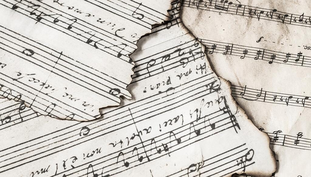 Music sheets with burnt edges.