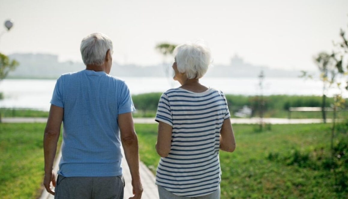 An elderly man and woman participating in senior-friendly outdoor activities.