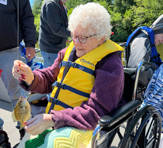 A resident caught a fish during a fishing activity